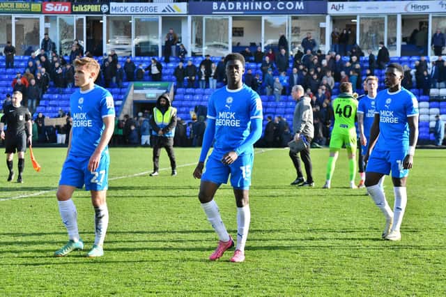 From the left, Archie Collins, MIchael Olakigbe and Ephron Mason-Clark troop off the pitch after the 3-1 home defeat at the hands of Carlisle. Photo David Lowndes.
