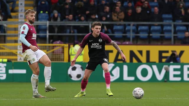 Kyle Barker in action for Posh in an FA Cup tie at Burnley.