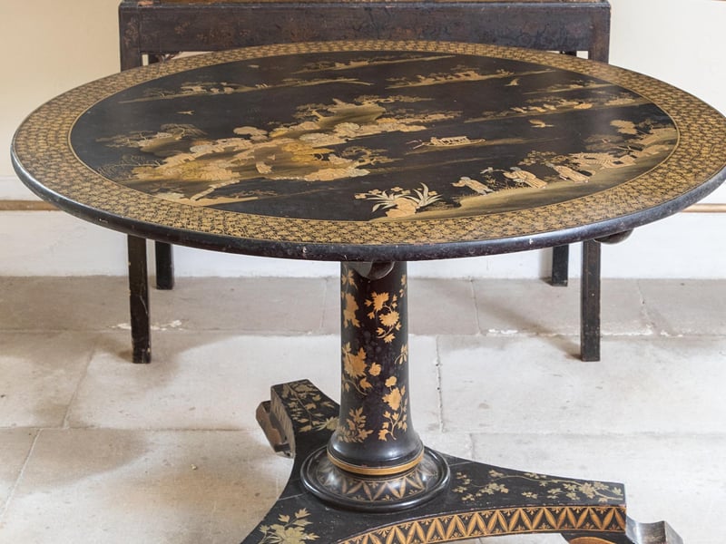 A Regency black and gilt Chinoiserie lacquered pedestal centre table - with an estimate of £700 - £1,000