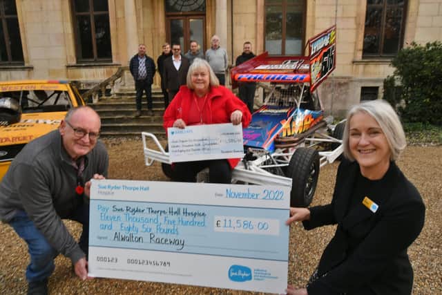 Sue Ryder Care cheque presentations to fundraiser Helen Kingston (right) from John Walsham (left) and members of Alwalton Raceway and (centre)  Tracy Smith from East Anglian Air Ambulance.