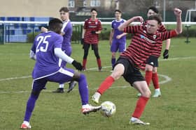 Action from Stanground (purple) v Park Farm Pumas in an under 18 League Cup quarter-final at the weekend. Stanground won 3-1. Photo: David Lowndes.