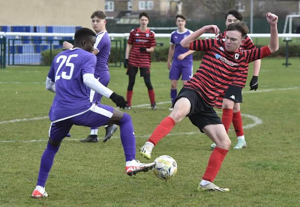 Action from Stanground (purple) v Park Farm Pumas in an under 18 League Cup quarter-final at the weekend. Stanground won 3-1. Photo: David Lowndes.