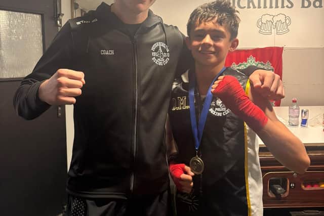 Coach Alfie Baker with Oliver Plumb.