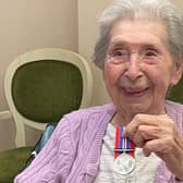 Eve with her medal, and inset, during her service