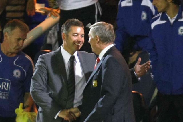 Sir Alex Ferguson shakes hands with his son Darren Ferguson after the pre-season friendly match between Peterborough United and  Manchester United at London Road on August 4 2008.