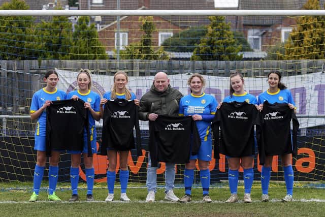 Peterborough Sports Ladies have received kit sponsorship from M & L Builders. Company owner Mark Hatfield is pictured with players, from left, Sophie Harold, Codie Steward, Ruby Gockel,  Evie Hatfield, Georgia Kulesza and Lillia Barhoumi. Photo: Tim Symonds.
