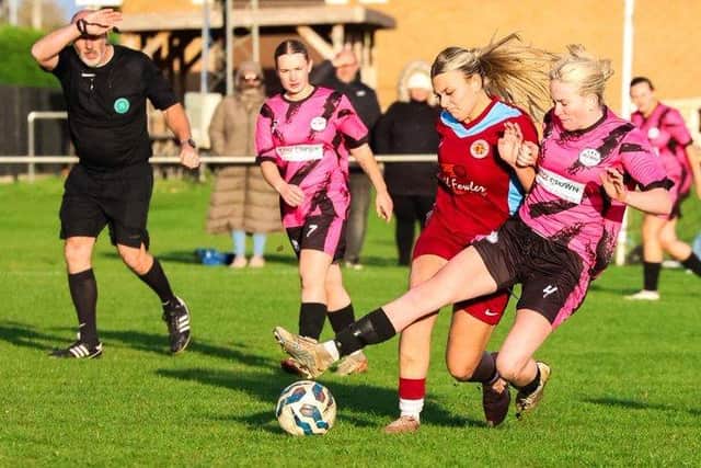 Action from Deeping Rangers Reserves (claret) v Girls United. Ruby Gockel (right) is the Girls United player. Photo Jason Richardson.