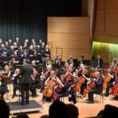 Hunts Phil choir and orchestra and Music Director Dan Watson on stage at Hinchingbrooke Performing Arts Centre