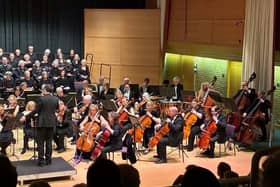 Hunts Phil choir and orchestra and Music Director Dan Watson on stage at Hinchingbrooke Performing Arts Centre