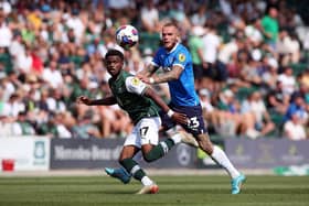 Joe Ward of Peterborough United in action with Bali Mumba of Plymouth Argyle at Home Park in August. Photo: Joe Dent/theposh.com.