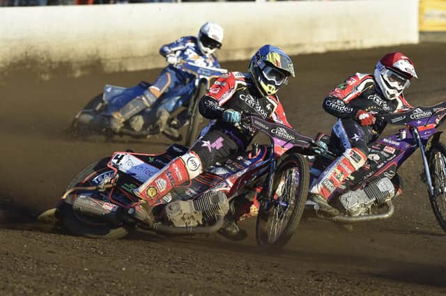Michael Palm Toft (red helmet) and Scott Nicholls (blue) in action for Panthers against King's Lynn earlier this season.  Photo: David Lowndes.