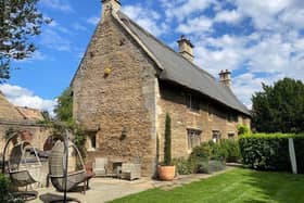 The property has many period features including exposed beams and stone work