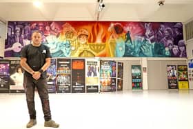 Nathan Murdoch puts the finishing touches to his Cresset mural on August 21 (image: Paul Marriott).