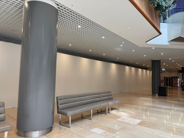 The new hoardings that show work is under way to creating  install the fixtures and fittings  required by retail giant Frasers as it prepares to move into the Queensgate Shopping Centre in Peterborough