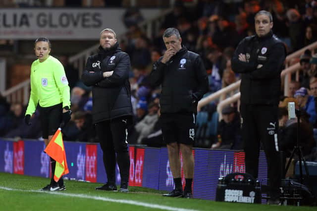 Peterborough United manager Grant McCann and his assistant Cliff Byrfne on the touchline against Barnsley. Photo: Joe Dent/theposh.com.