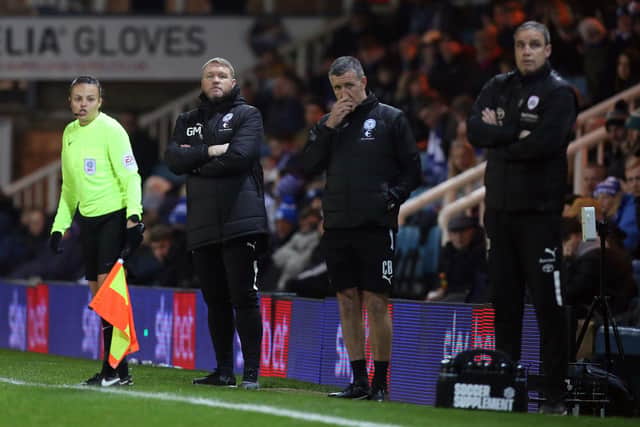Peterborough United manager Grant McCann and his assistant Cliff Byrfne on the touchline against Barnsley. Photo: Joe Dent/theposh.com.
