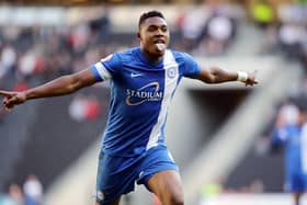 Britt Assombalonga celebrates a Posh goal in 2014.
