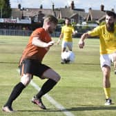 MIchael Gash (orange) in action for Peterborough Sports.