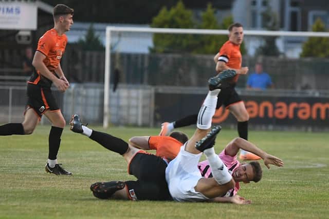 The aftermath of Connor Johnson's red card challenge. Photo: David Lowndes.