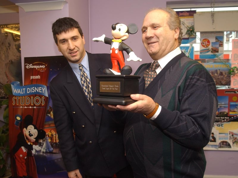 Daniele and Carlo Broccoli from Britaly Travel with their "Mousecar" award for being the top travel agent supplying Euro Disney.