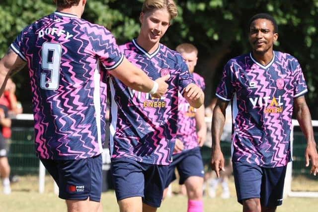 Luca Miller (centre) has just scored for Peterborough Sports at Blackstones. Photo Darren Wiles.