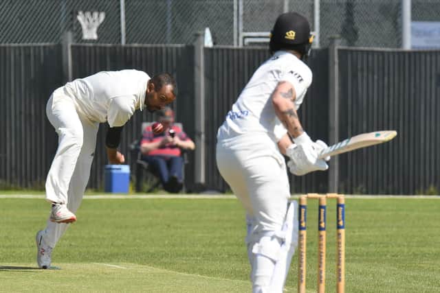 Tom Norman bowling for Oundle Town against Peterborough Town. Photo: David Lowndes.