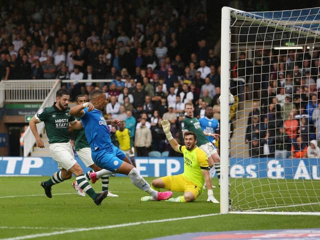 Jonson Clarke-Harris of Peterborough United scores the opening goal of the game against Derby County. Photo: Joe Dent/theposh.com