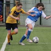 Jess Driscoll (blue) in action for Posh Women.