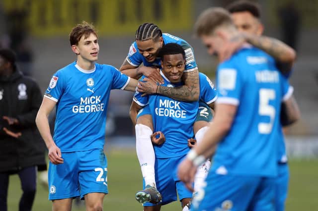 Peterborough United players celebrate the victory at full-time. Photo: Joe Dent.