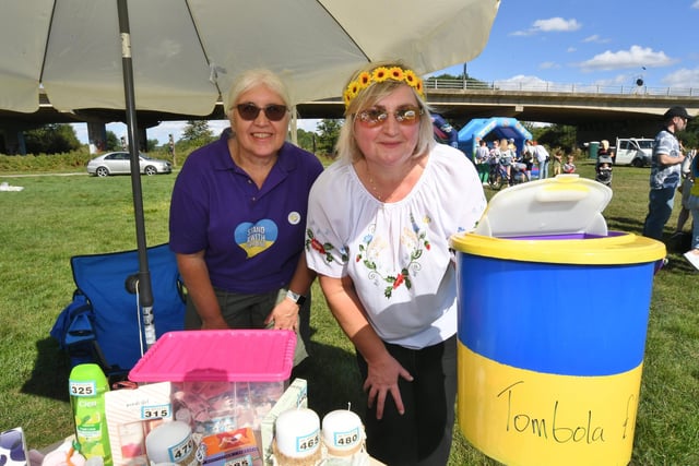 Ukraine Independence Day picnic at Orton Mere where Luba Kelly and Oksama Mauro are pictured running a tombola.