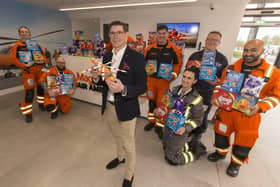 B&amp;DWC - 8514 - David from David Wilson Homes presenting Magpas Air Ambulance with their Easter eggs