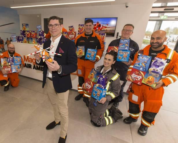 B&amp;DWC - 8514 - David from David Wilson Homes presenting Magpas Air Ambulance with their Easter eggs