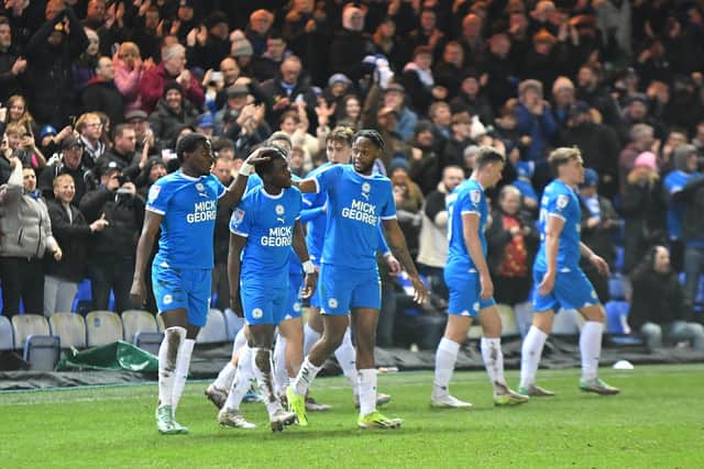 Posh players celebrate Kwame Poku's goal against Northampton. Photo David Lowndes.