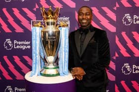 Andy Cole in front of the Premier League Trophy at last year’s gala dinner. Photo: Kidney Research UK.