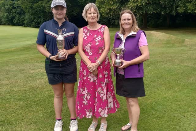 Champions Ellie Horsted (left) and Angela Roper (right) with Milton Golf Club Ladies Captain Lesley Fredericks.