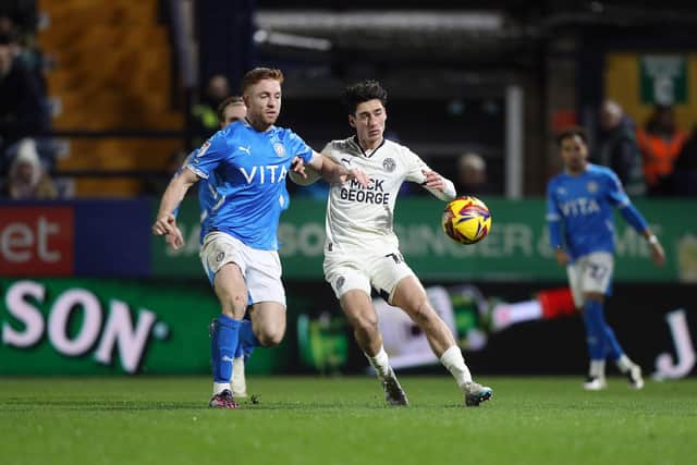 STOCKPORT, ENGLAND - DECEMBER 21: Joel Randall of Peterborough United competes with Callum Camps of Stockport County during the Sky Bet League One match between Stockport County FC and Peterborough United FC at Edgeley Park on December 20, 2024 in Stockport, England. (Photo by Joe Dent - PUFC/Peterborough United via Getty Images)