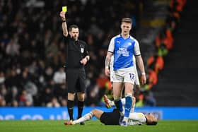 Peterborough's Josh Knight is booked against Fulham. It is one of 80 yellows for Posh this season.