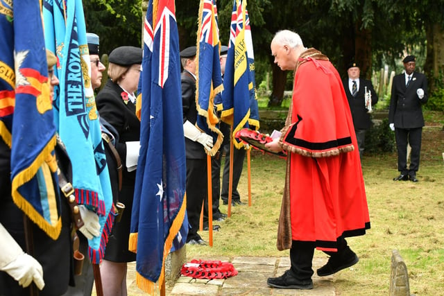 Mayor of Peterborough Nick Sandford lays a wreath