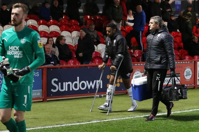 Nathan Thompson leaves Accrington Stanley on crutches. Photo: Joe Dent/theposh.com.