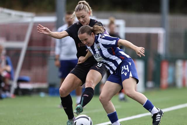 Keir Perkins (left) in action for Posh Women at West Bromwich Albion. Photo Darren Wiles.