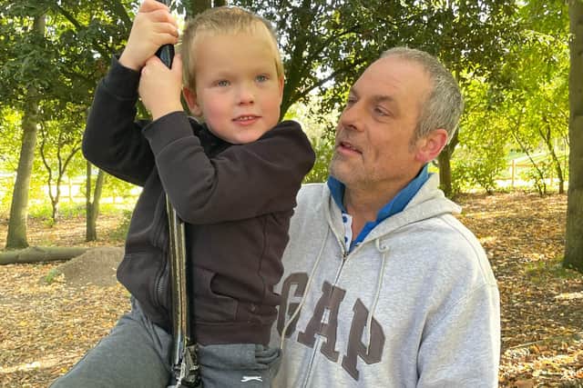 Jason Lovett, 49, and his five-year-old son, Anakin, who has autism