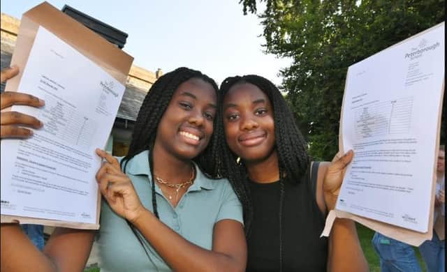 GCSE Results Day at The Peterborough School.. Identical twins with identical results Gabrielle and Danielle Owusu-Ansah
