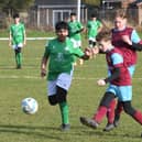 Action from a recent under 13 game between Deeping Rangers and FC Peterborough (green). Photo: David Lowndes.