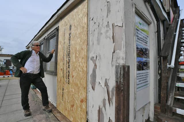 Brian Pearce with damage caused by thieves at the Railworld Wildlife Haven