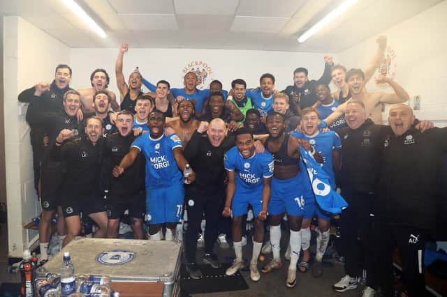 Posh's players are staff celebrate reaching Wembley with victory over Blackpool. Photo: Joe Dent.