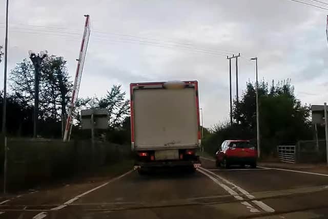 The moment a car overtakes a lorry at Tallington Level Crossing