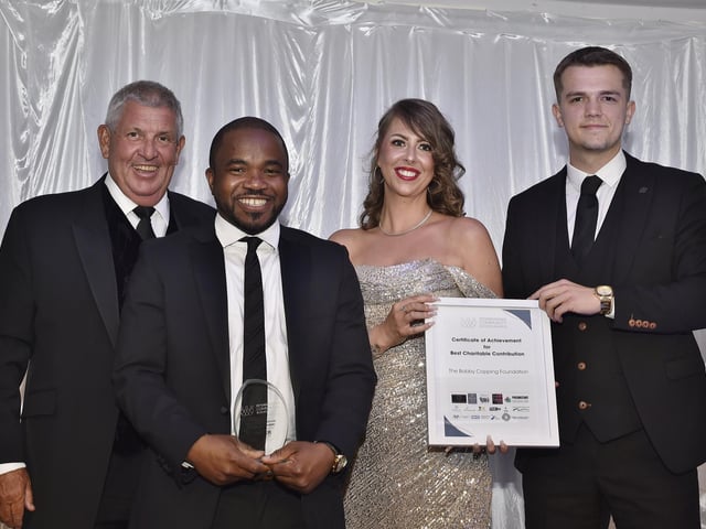 Sponsor Iain Forsythe with winners the Dominion Christian Centre and the Bobby Copping Foundation