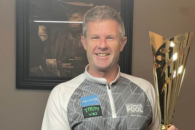 Mark Gray with the trophy he won in Blackpool.
