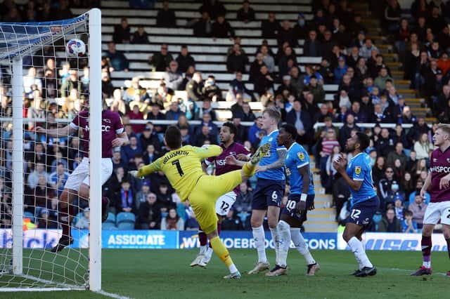 Peterborough United players watch on as an effort hits the crossbar against Derby County. Photo: Joe Dent/theposh.com.