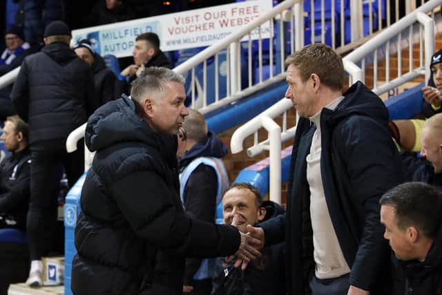 Honours were even between Darren Ferguson and his former player Dean Holden. Photo: Joe Dent.